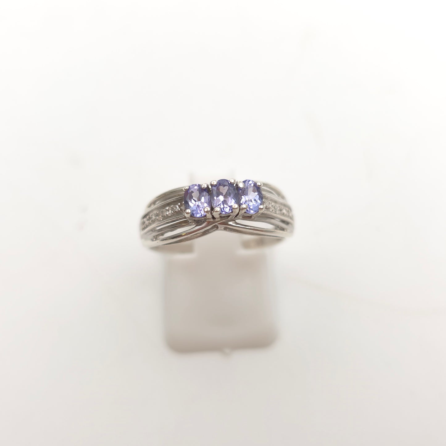 Sterling Silver Oval Cut Tanzanite Trilogy And Diamond Set Shoulders Ring