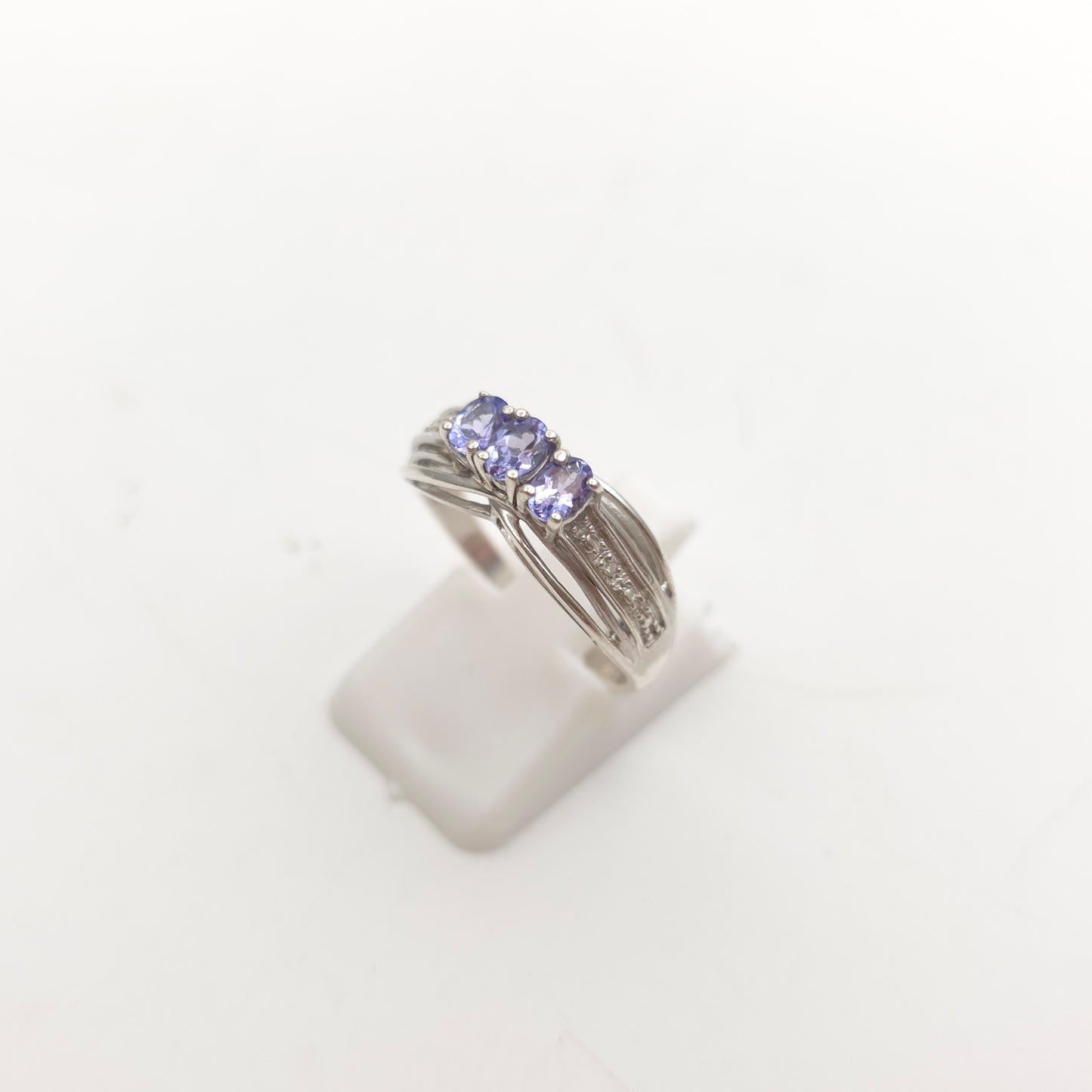 Sterling Silver Oval Cut Tanzanite Trilogy And Diamond Set Shoulders Ring