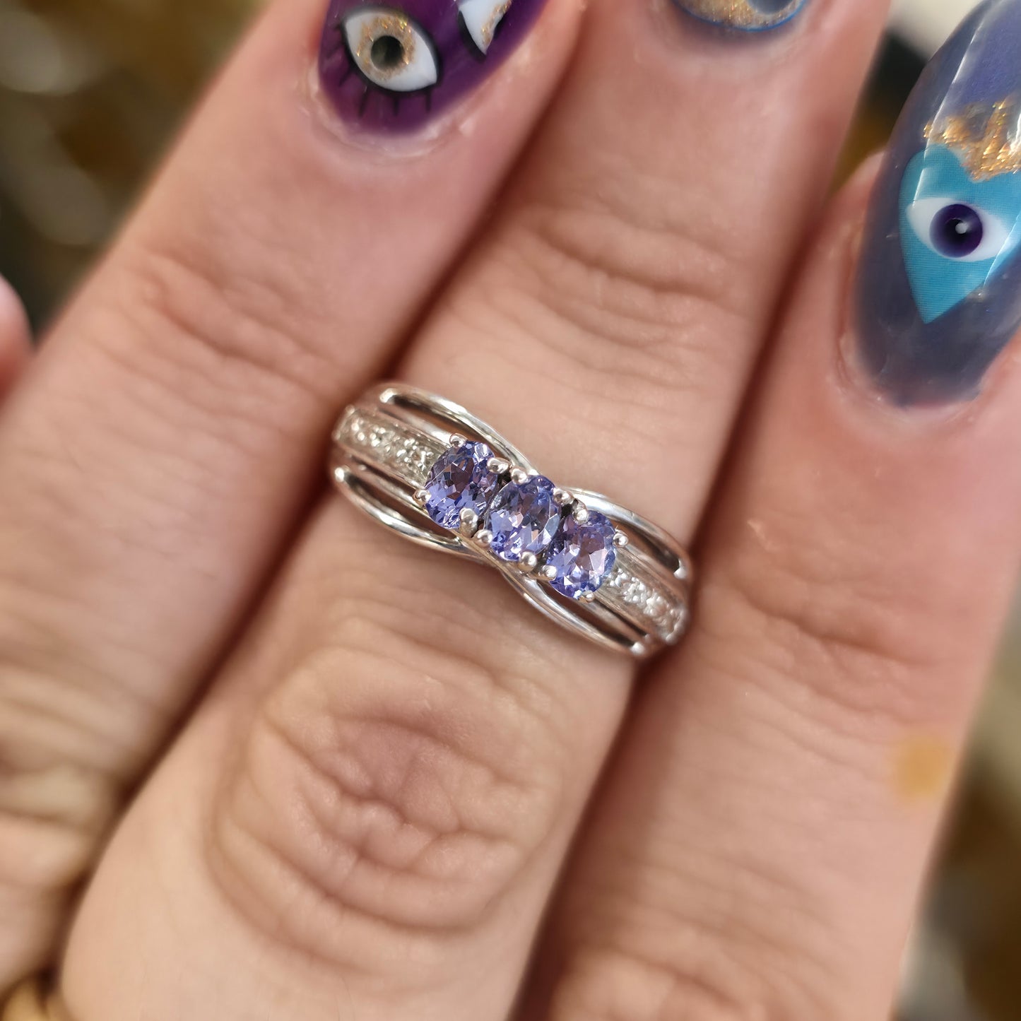 Sterling Silver Oval Cut Tanzanite Trilogy And Diamond Set Shoulders Ring