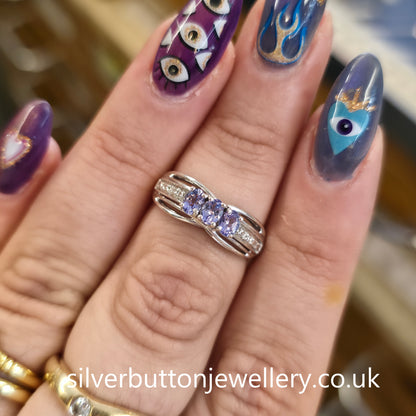 Sterling Silver Oval Cut Tanzanite Trilogy And Diamond Set Shoulders Ring