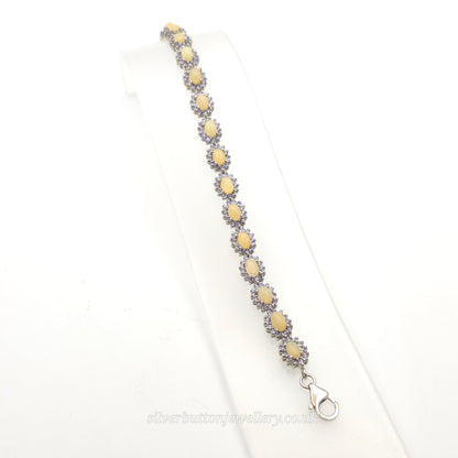 Sterling Silver Oval Cabochon Opal And Round Cut Tanzanite Cluster Bracelet