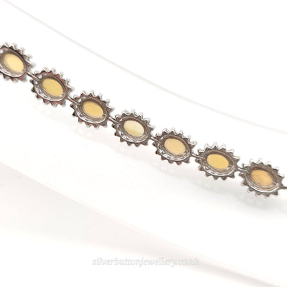 Sterling Silver Oval Cabochon Opal And Round Cut Tanzanite Cluster Bracelet