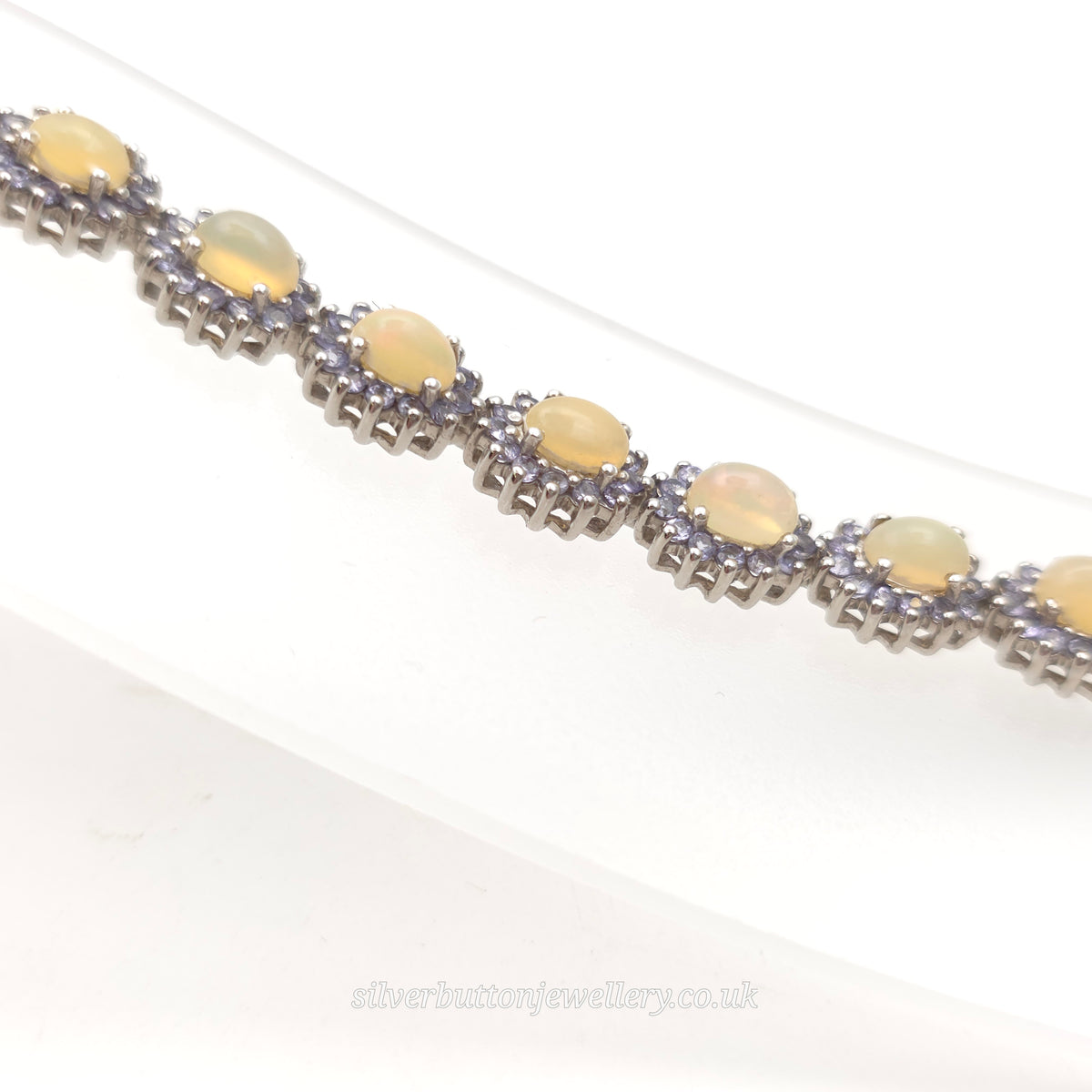 Sterling Silver Oval Cabochon Opal And Round Cut Tanzanite Cluster Bracelet