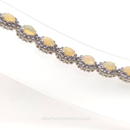 Sterling Silver Oval Cabochon Opal And Round Cut Tanzanite Cluster Bracelet