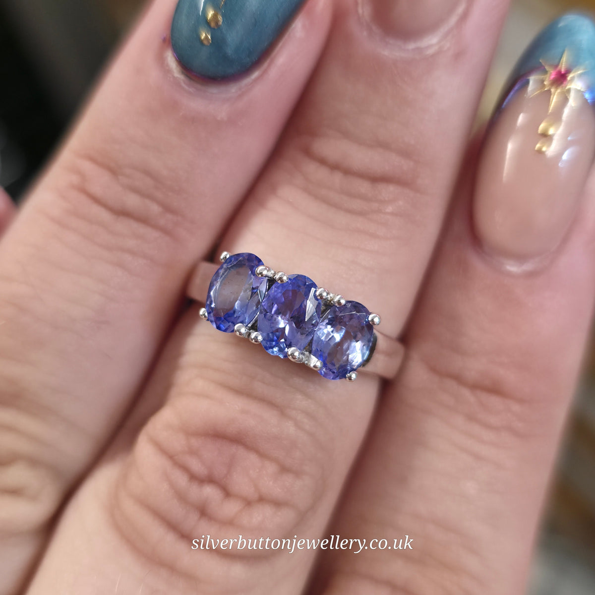 Sterling Silver Oval Cut Tanzanite Three Stone Trilogy Ring