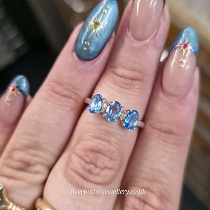 Sterling Silver Three Oval Cut Blue Topaz And White Stone Multi-Stone Ring