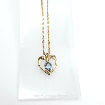 9ct Yellow Gold Pear Cut Blue Topaz Open Heart Pendant And Chain Necklace