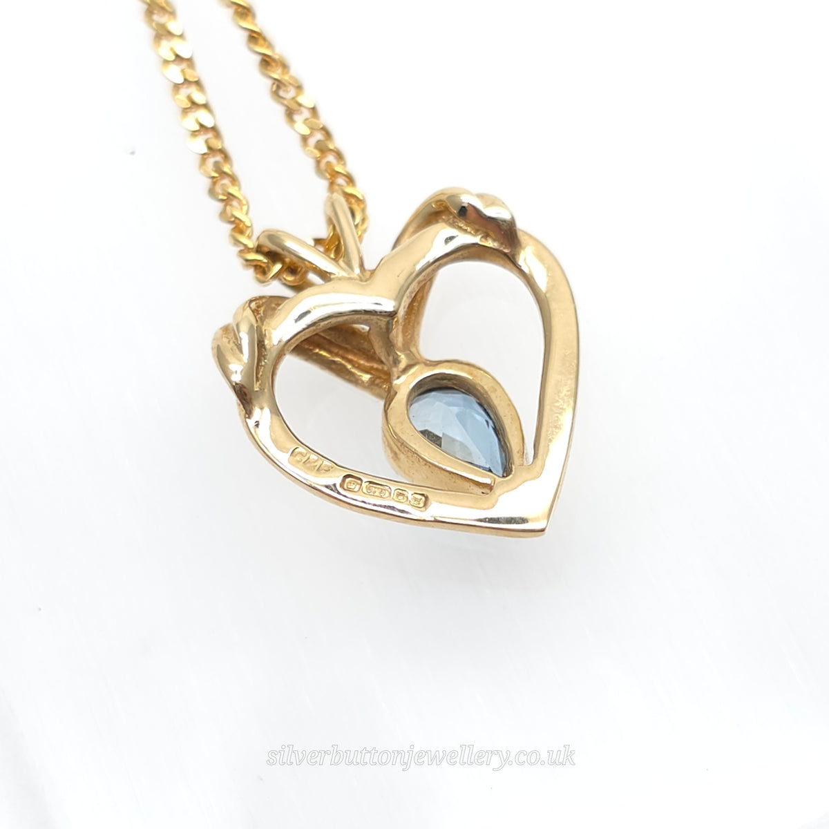 9ct Yellow Gold Pear Cut Blue Topaz Open Heart Pendant And Chain Necklace