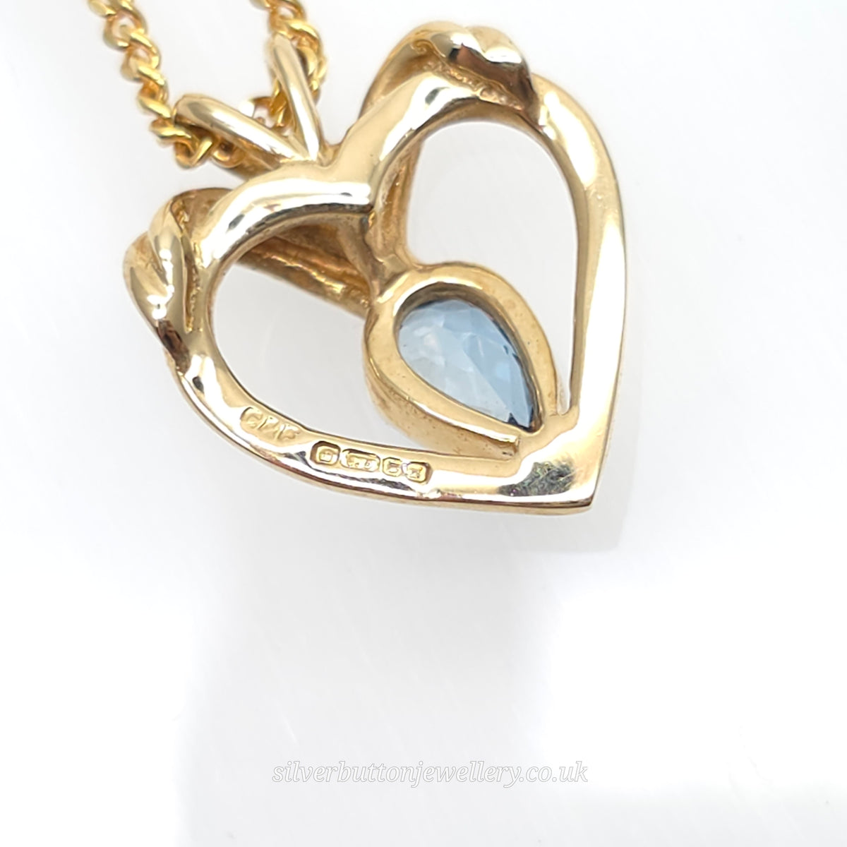 9ct Yellow Gold Pear Cut Blue Topaz Open Heart Pendant And Chain Necklace