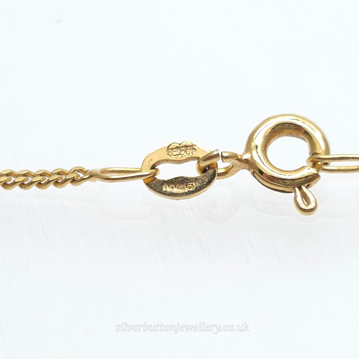 9ct Yellow Gold Pear Cut Blue Topaz Open Heart Pendant And Chain Necklace