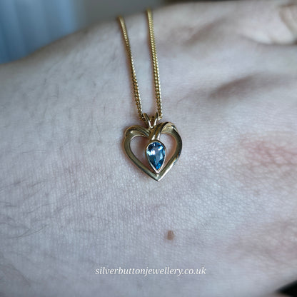 9ct Yellow Gold Pear Cut Blue Topaz Open Heart Pendant And Chain Necklace