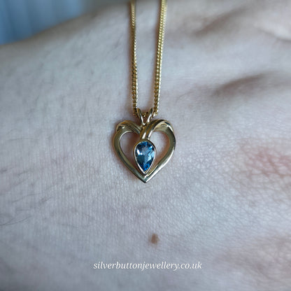 9ct Yellow Gold Pear Cut Blue Topaz Open Heart Pendant And Chain Necklace