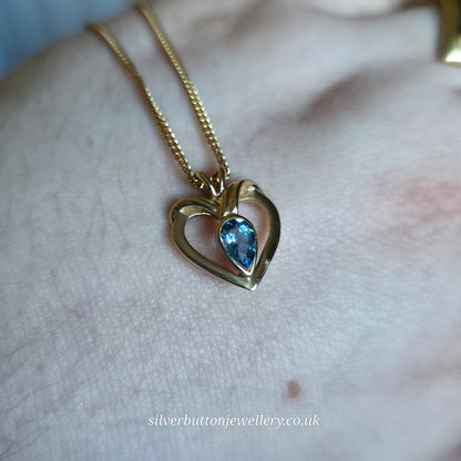 9ct Yellow Gold Pear Cut Blue Topaz Open Heart Pendant And Chain Necklace
