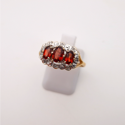 9ct yellow gold traditional 3 stone garnet and diamond ring