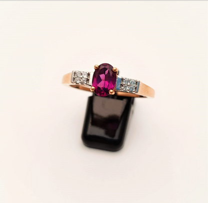 9ct Rose Gold Oval Garnet and white stone solitaire with accents ring