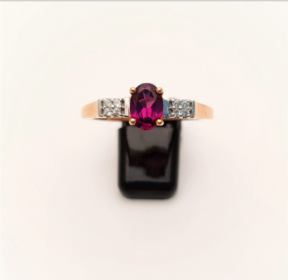 9ct Rose Gold Oval Garnet and white stone solitaire with accents ring