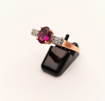 9ct Rose Gold Oval Garnet and white stone solitaire with accents ring