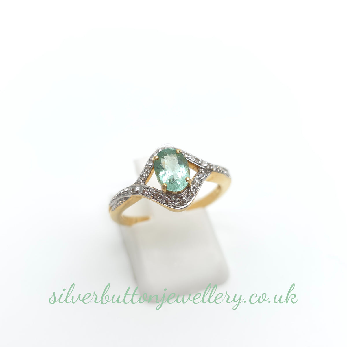 18ct Yellow Gold Oval Cut Paraiba Tourmaline And Diamond Open Crossover Ring
