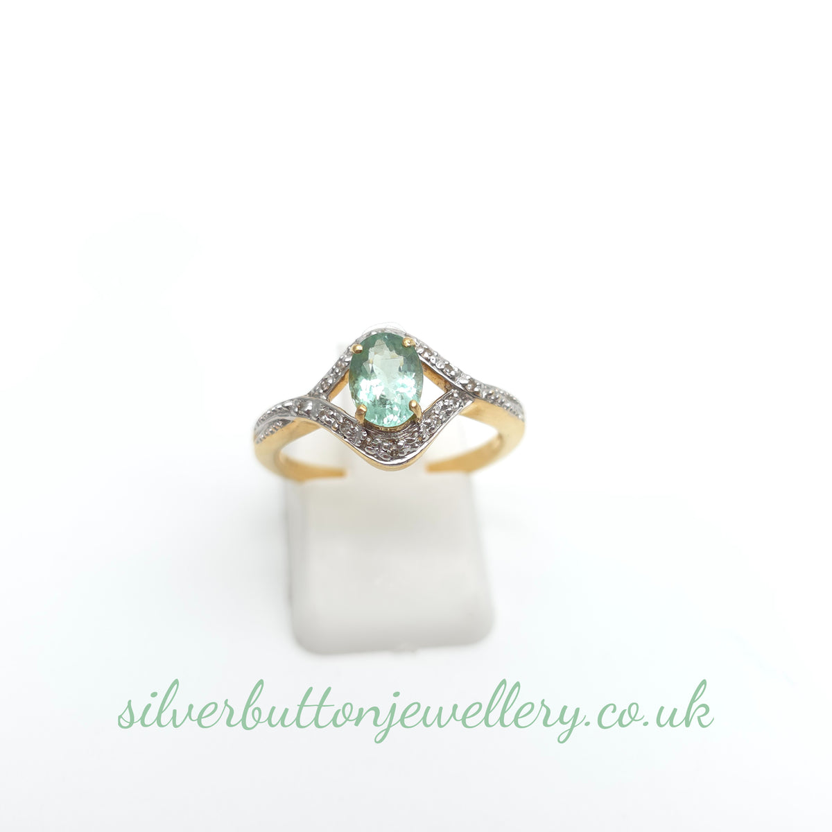 18ct Yellow Gold Oval Cut Paraiba Tourmaline And Diamond Open Crossover Ring