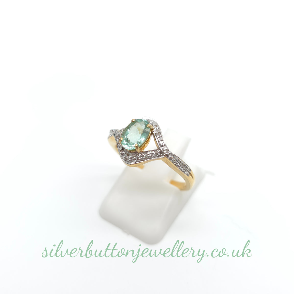 18ct Yellow Gold Oval Cut Paraiba Tourmaline And Diamond Open Crossover Ring