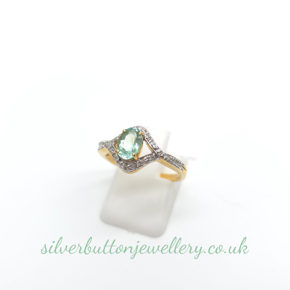 18ct Yellow Gold Oval Cut Paraiba Tourmaline And Diamond Open Crossover Ring