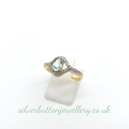 18ct Yellow Gold Oval Cut Paraiba Tourmaline And Diamond Open Crossover Ring