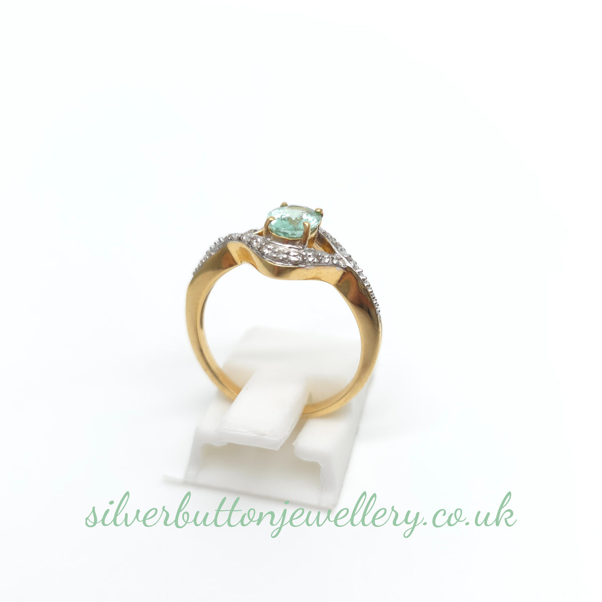 18ct Yellow Gold Oval Cut Paraiba Tourmaline And Diamond Open Crossover Ring