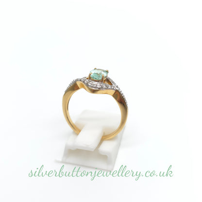18ct Yellow Gold Oval Cut Paraiba Tourmaline And Diamond Open Crossover Ring