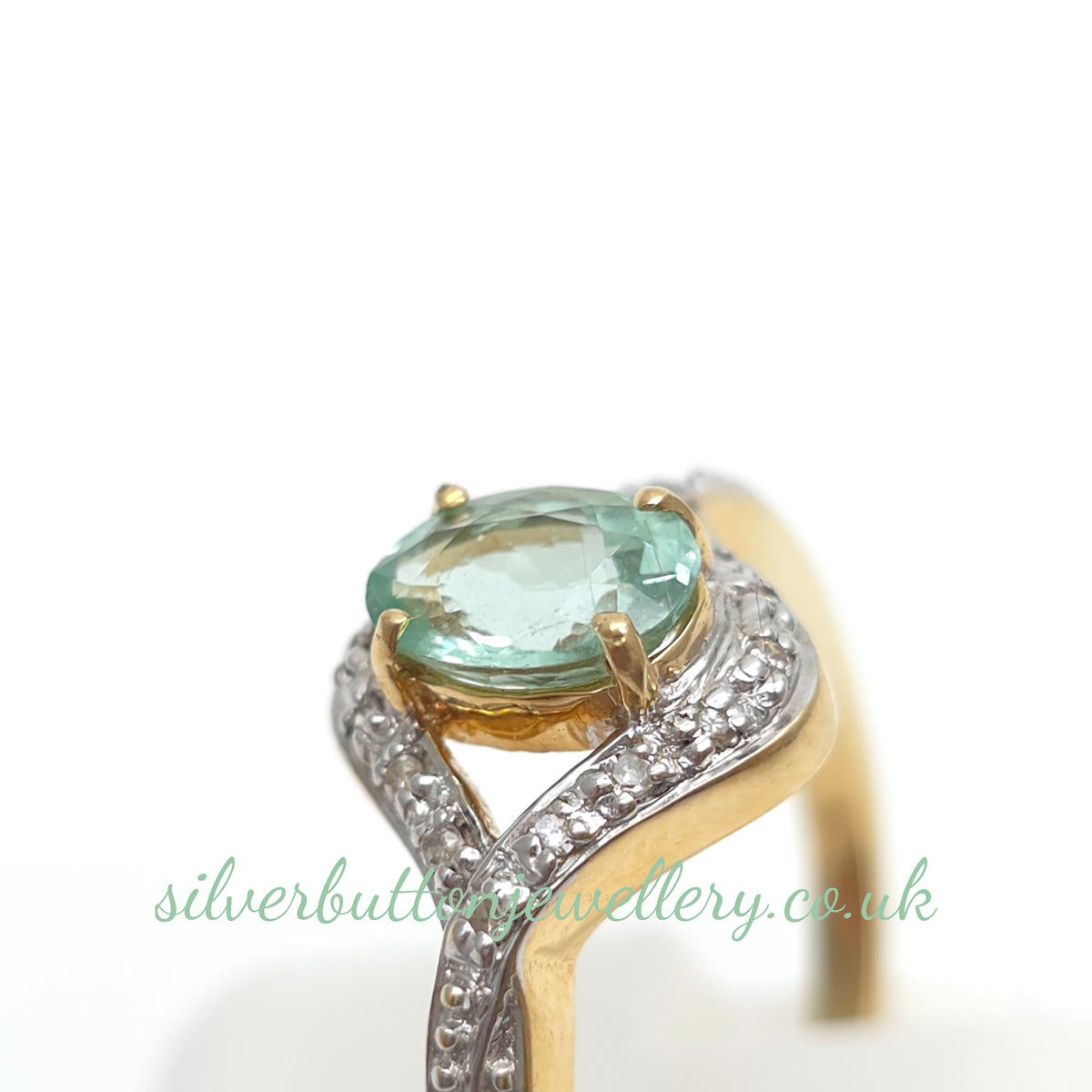 18ct Yellow Gold Oval Cut Paraiba Tourmaline And Diamond Open Crossover Ring