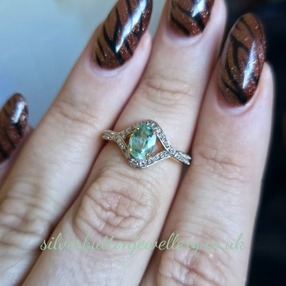18ct Yellow Gold Oval Cut Paraiba Tourmaline And Diamond Open Crossover Ring