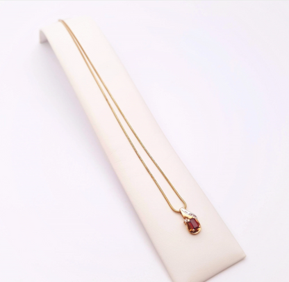 9ct yellow gold garnet and diamond two-tone pendant and chain necklace.